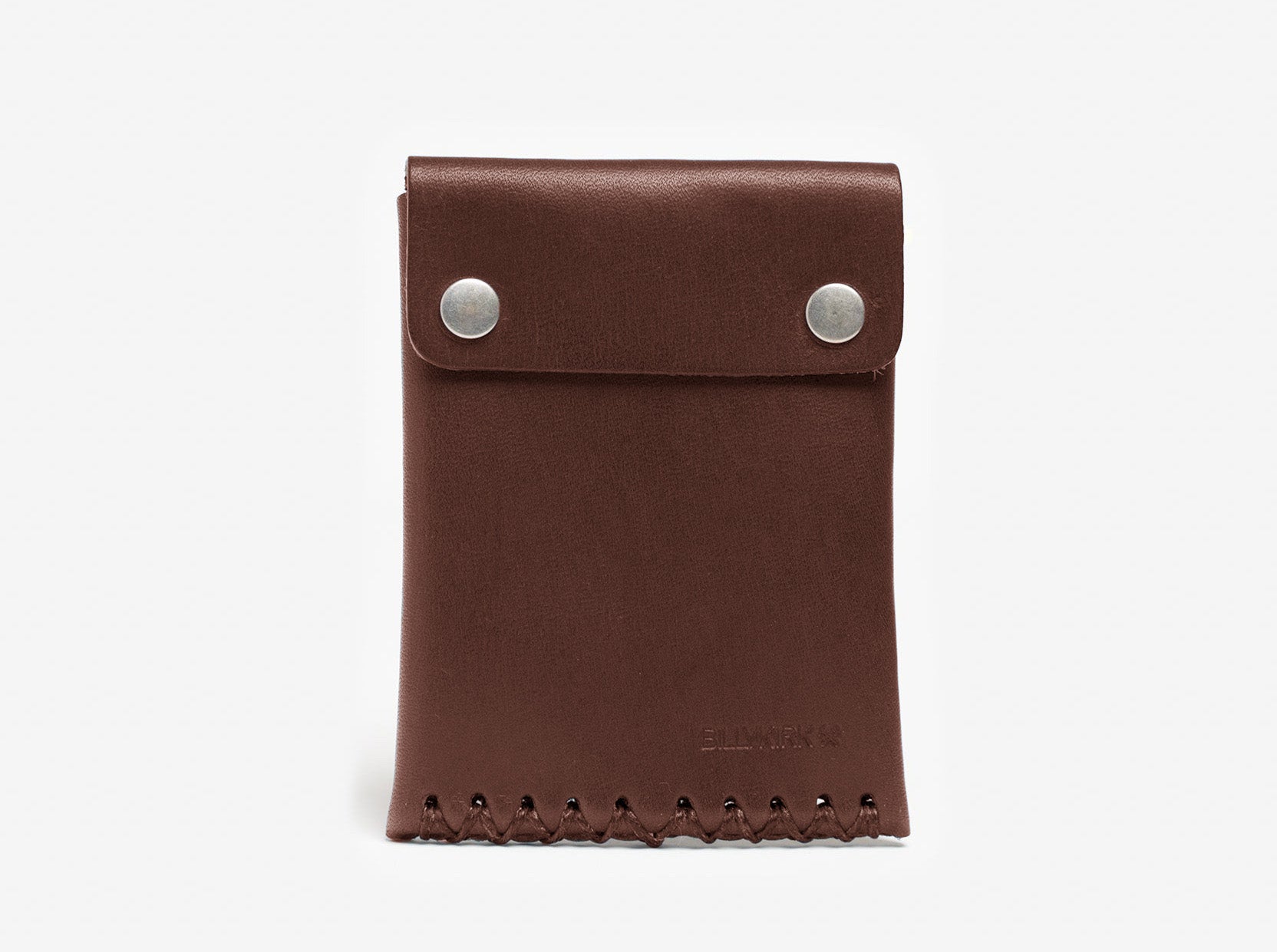 A brown leather wallet with two silver snap buttons on the front flap and visible stitching along the bottom edge, photographed against a plain white background.