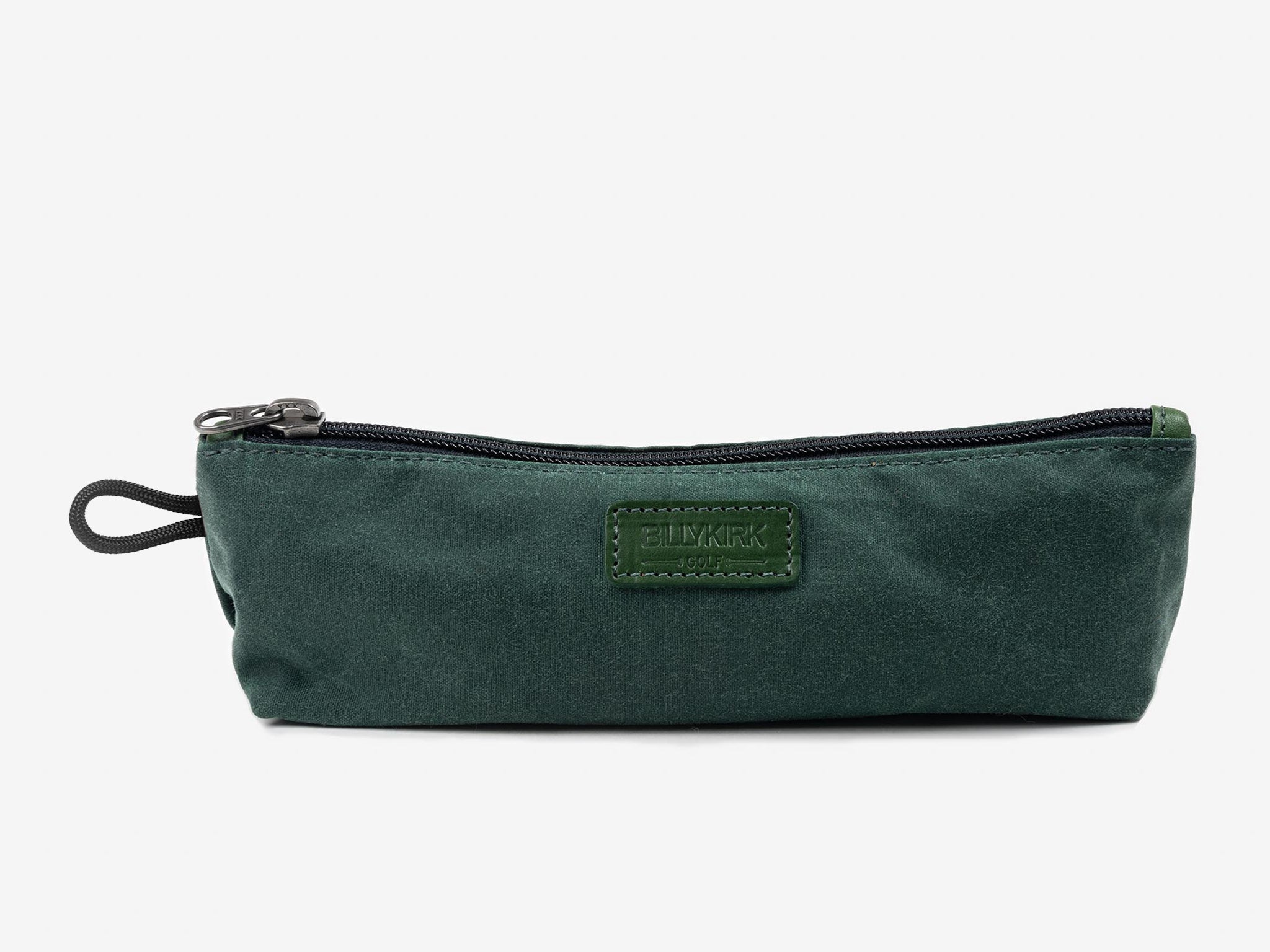 A dark green zippered pouch with a black pull cord and a rectangular stitched label on the front, set against a plain white background.