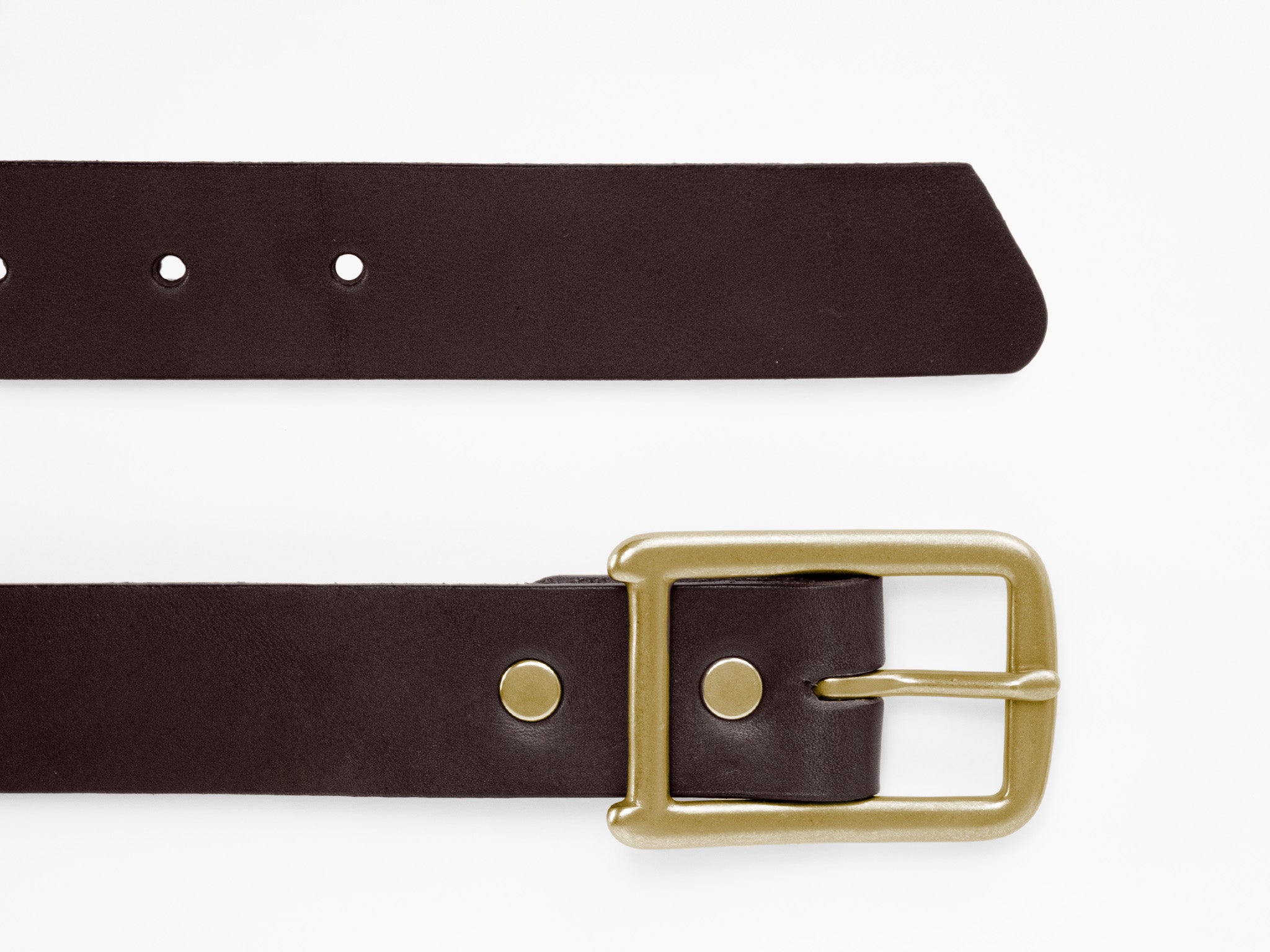 A dark brown leather belt with a brass buckle and several holes, laid flat on a white background.
