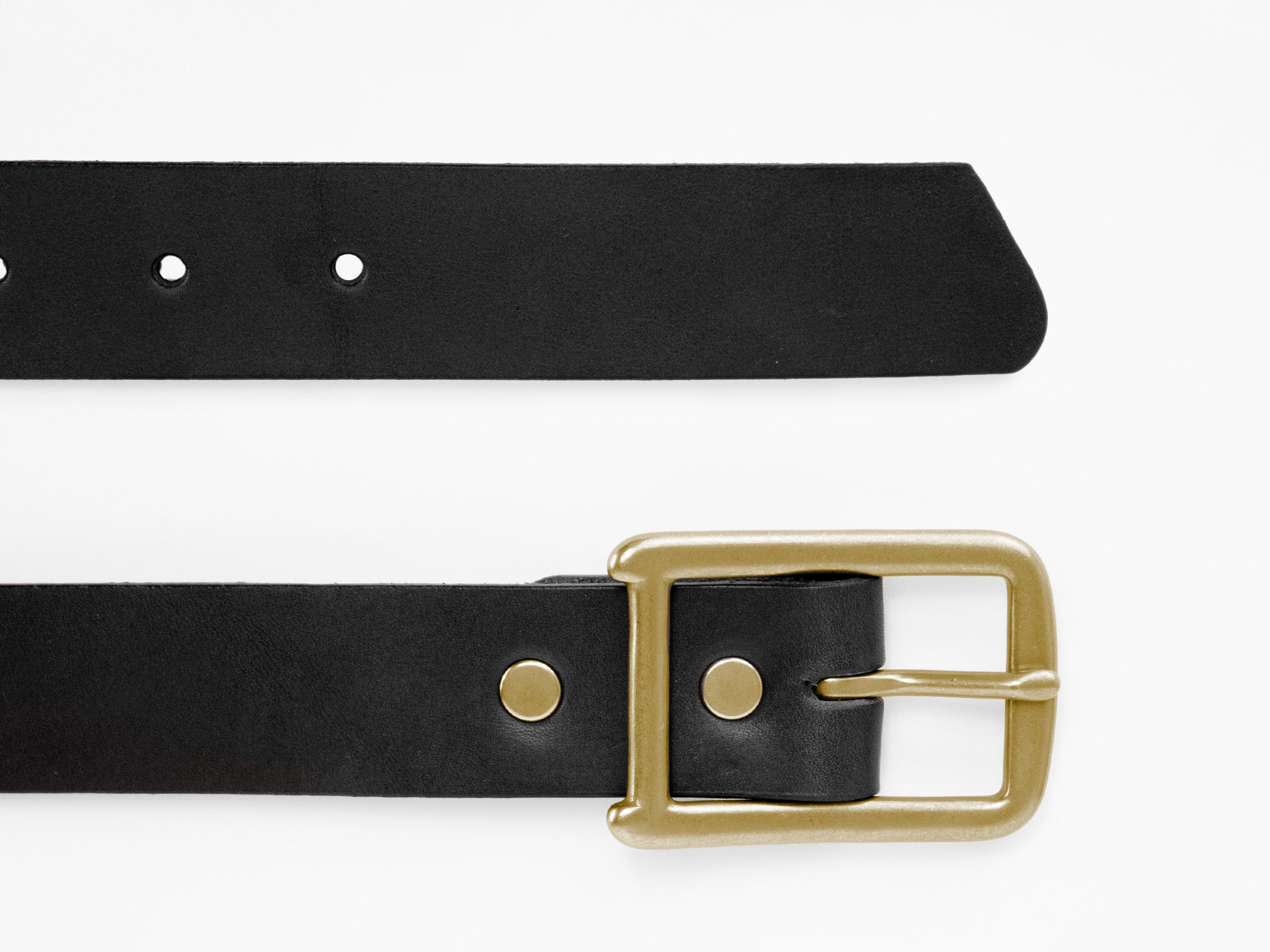 A black leather belt with a gold rectangular buckle and metal accents, laid flat on a white background. The belt’s pointed end and several adjustment holes are visible.