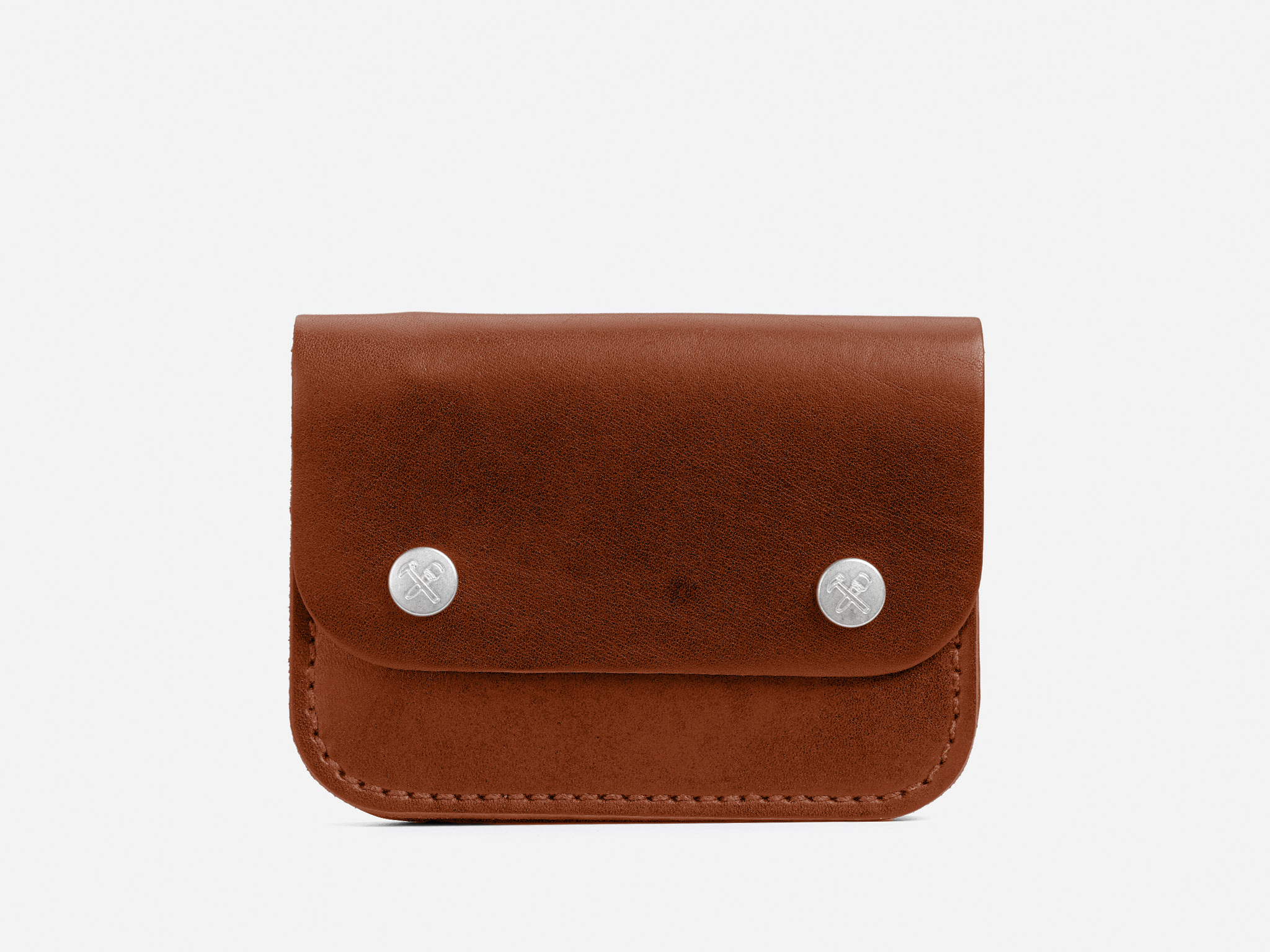 A small brown leather pouch with a flap secured by two silver snap buttons, displayed against a plain white background.