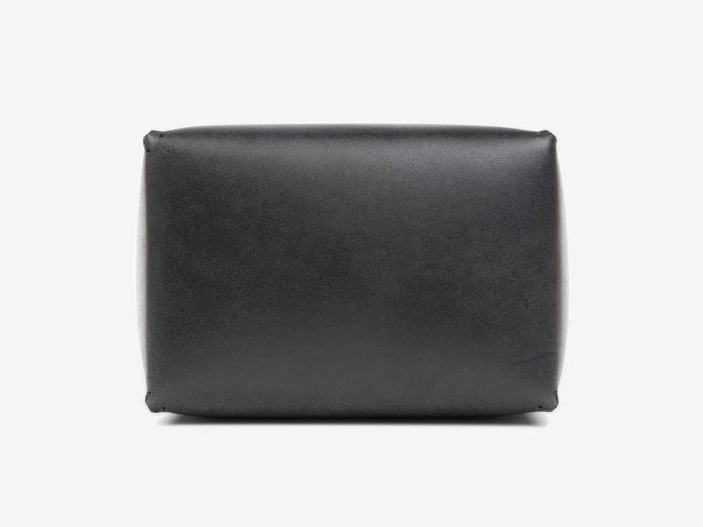 Top view of a black leather box lid showing where the debossed personalization gets stamped. Set against a white background.