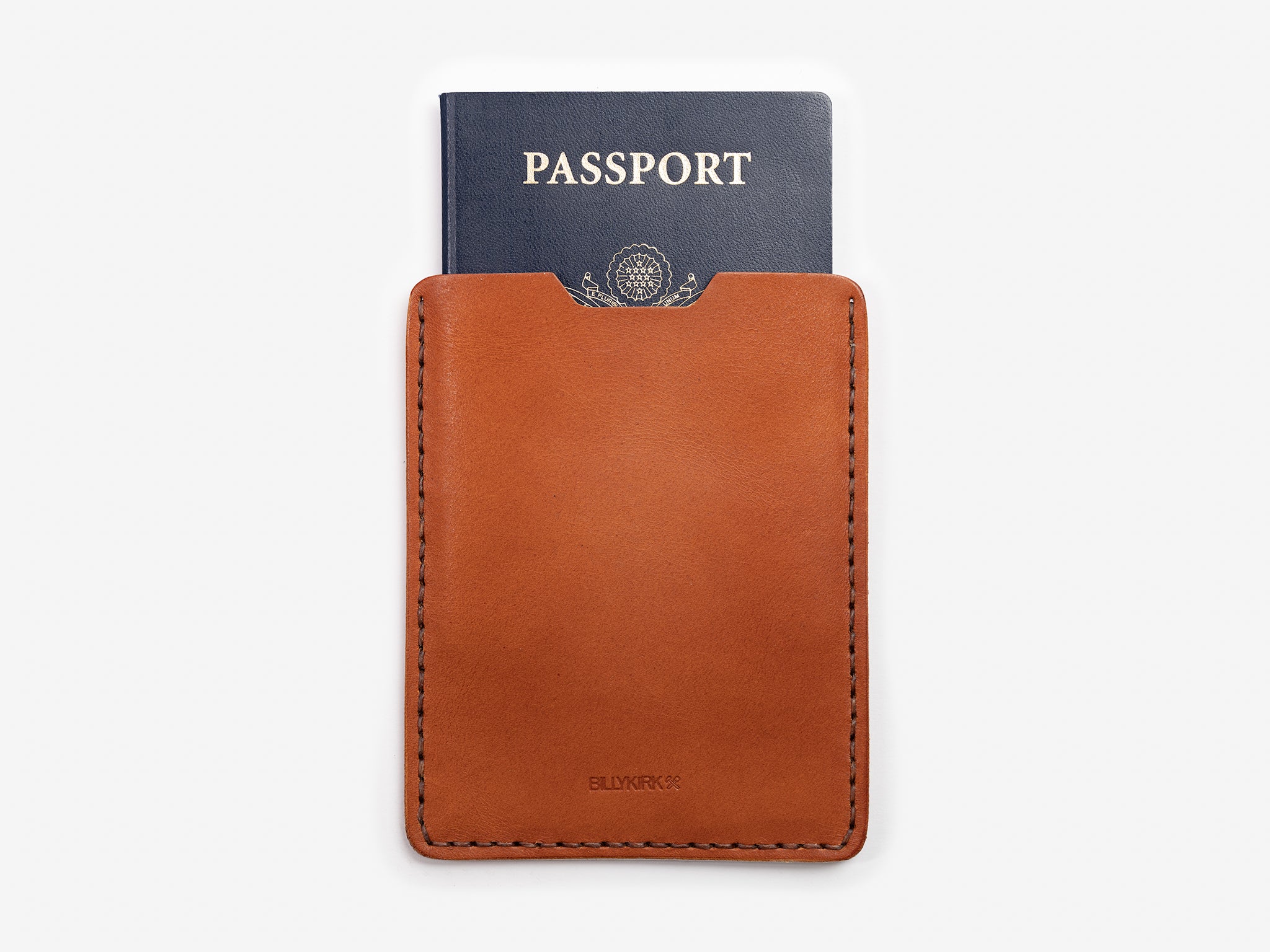 Passport Sleeve shown in tan Leather with a passport coming out of the top of the sleeve. Set against a white background
