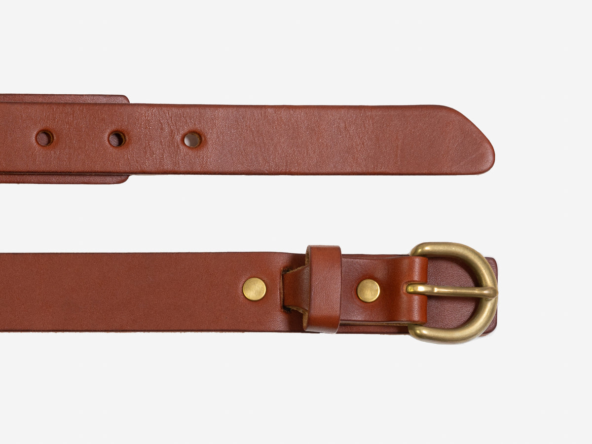 A brown leather belt with a brass buckle and metal rivets, shown laid flat on a white background. The top section displays the belt strap with holes, while the bottom section shows the buckle and keeper loop.