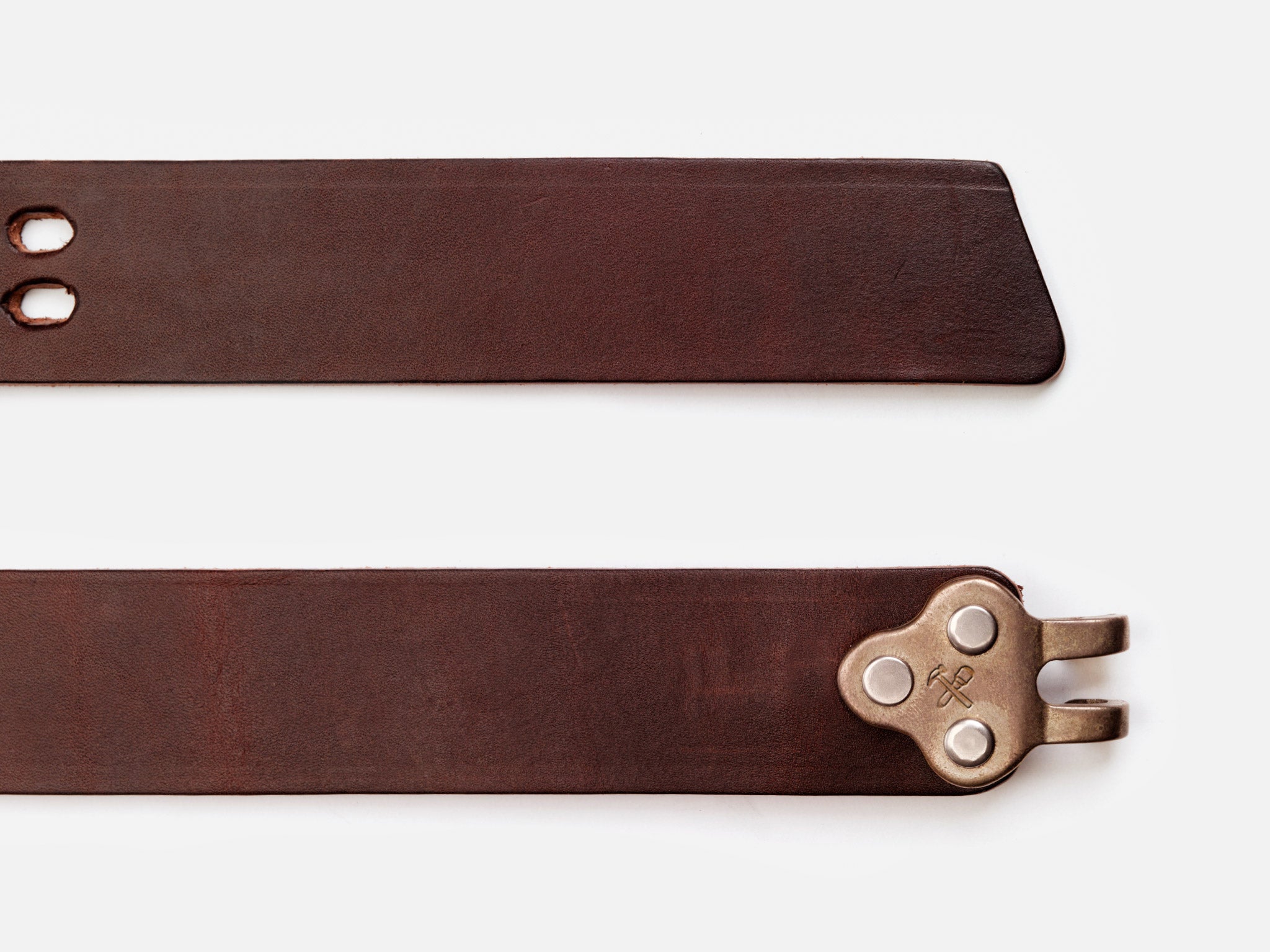 Two strips of brown leather belt shown against a white background; one end is pointed with holes, and the other features a metal buckle mechanism with two prongs and screws.